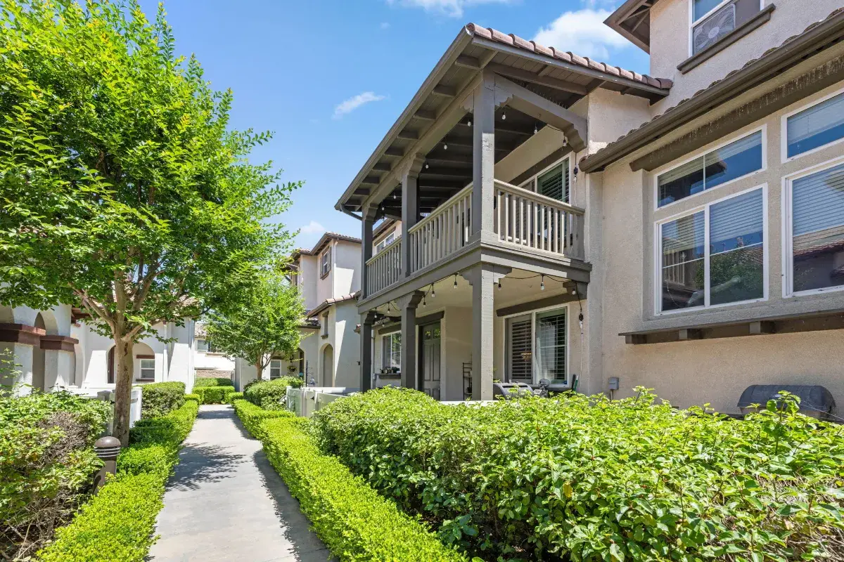 Townhome exterior and landscaped walkway at 33680 Willow Haven Lane #103, Murrieta